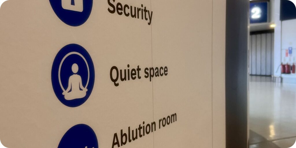 Conference sign showing quiet space and security directions